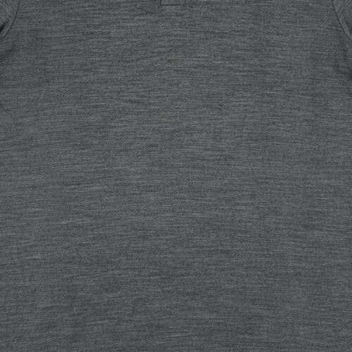 A dark gray short-sleeve polo shirt with a textured heathered fabric, featuring a two-button placket and a small black brand tag near the bottom hem, displayed flat against a white background.