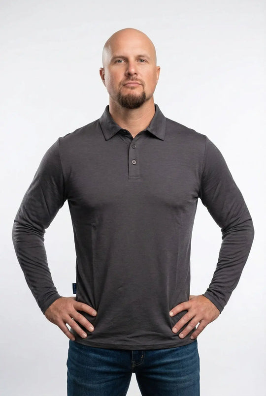 Man wearing a gray long-sleeve polo shirt against a white background