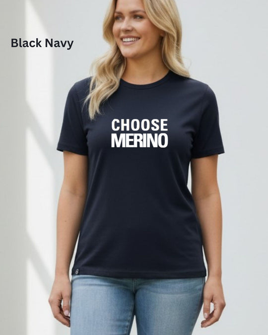 A woman wearing a black navy crewneck t-shirt with the slogan &