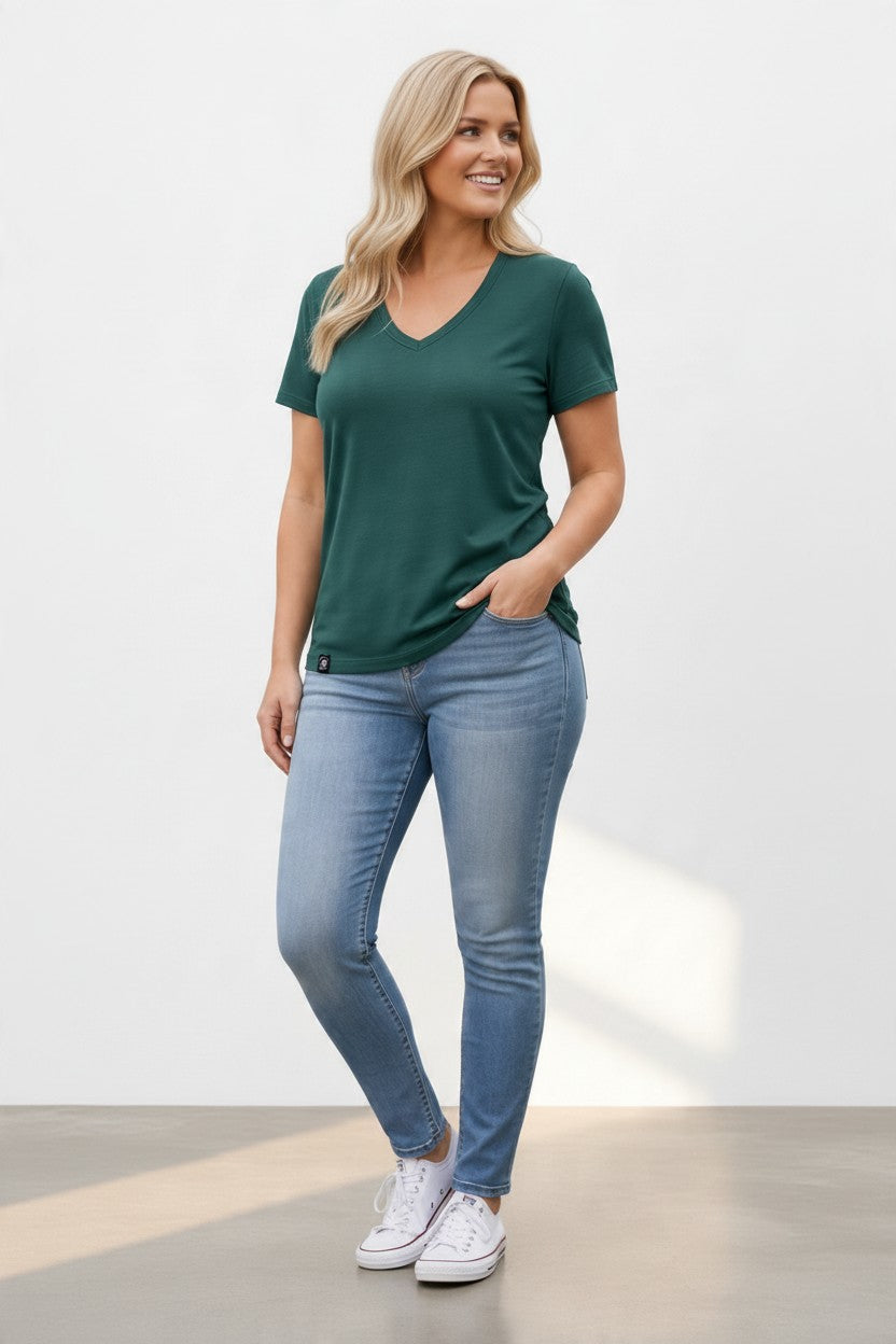 blonde woman in green merino wool t-shirt