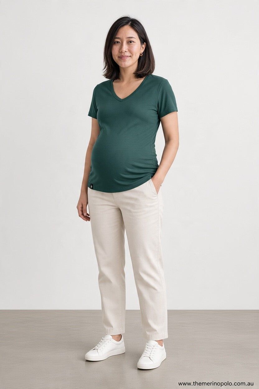 pregnant woman in green merino wool t-shirt