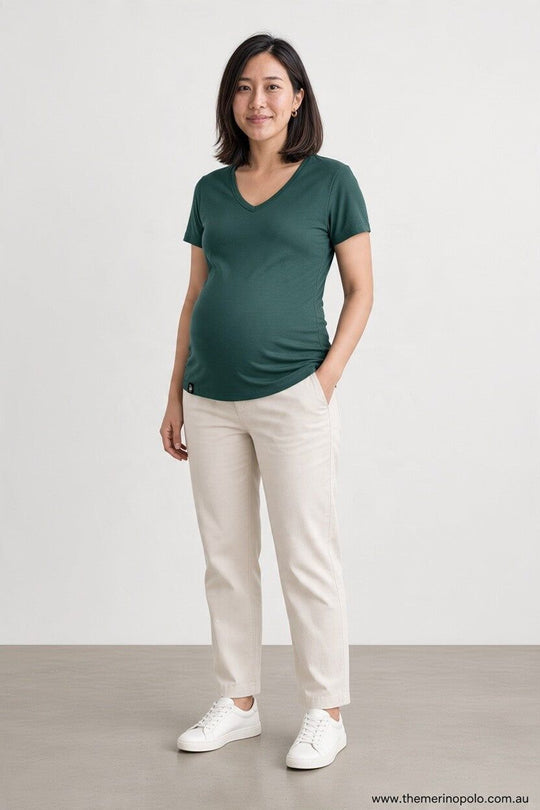 pregnant woman in green merino wool t-shirt