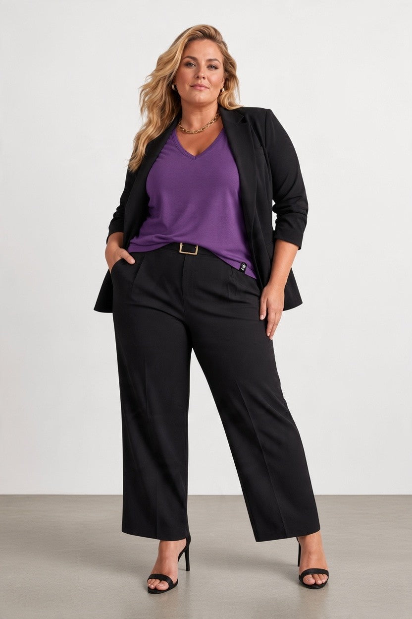 Pregnant woman in purple merino wool t-shirt and black jacket