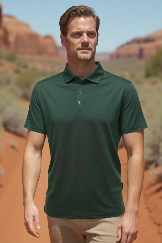 Man wearing a green polo shirt in a desert setting