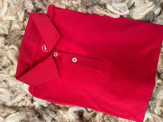 Red polo shirt on a textured surface