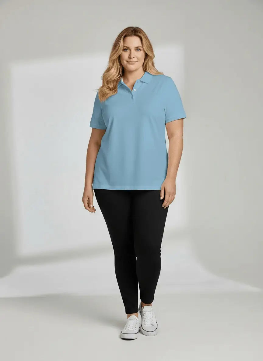 Woman wearing a light blue polo shirt and black pants on a white background
