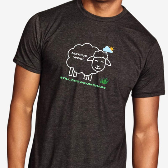 Person wearing a dark gray t-shirt with a sheep graphic and text on a white background