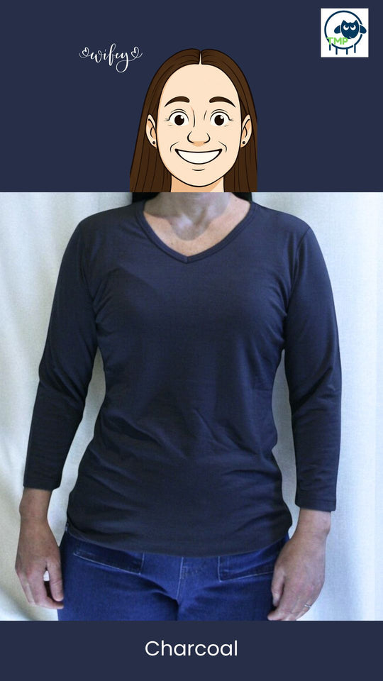 Person wearing a dark blue long-sleeve shirt against a white background