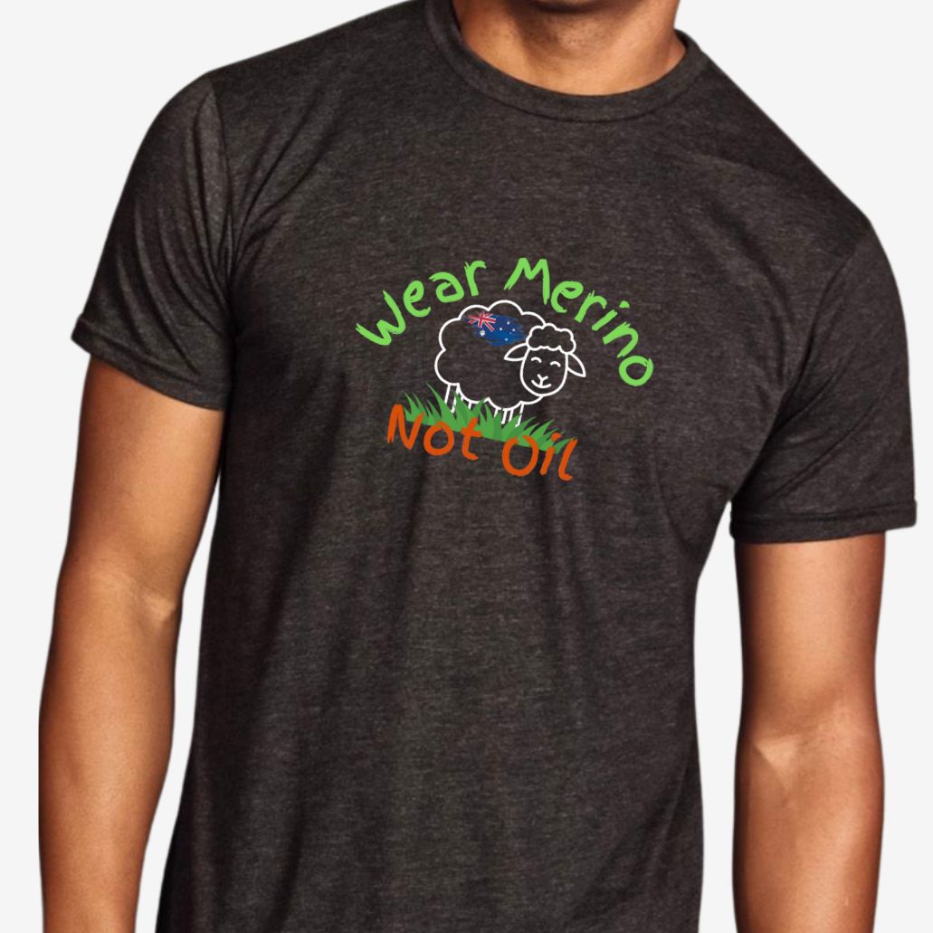 Person wearing a dark gray t-shirt with 'Wear Merino Not Oil' graphic design.